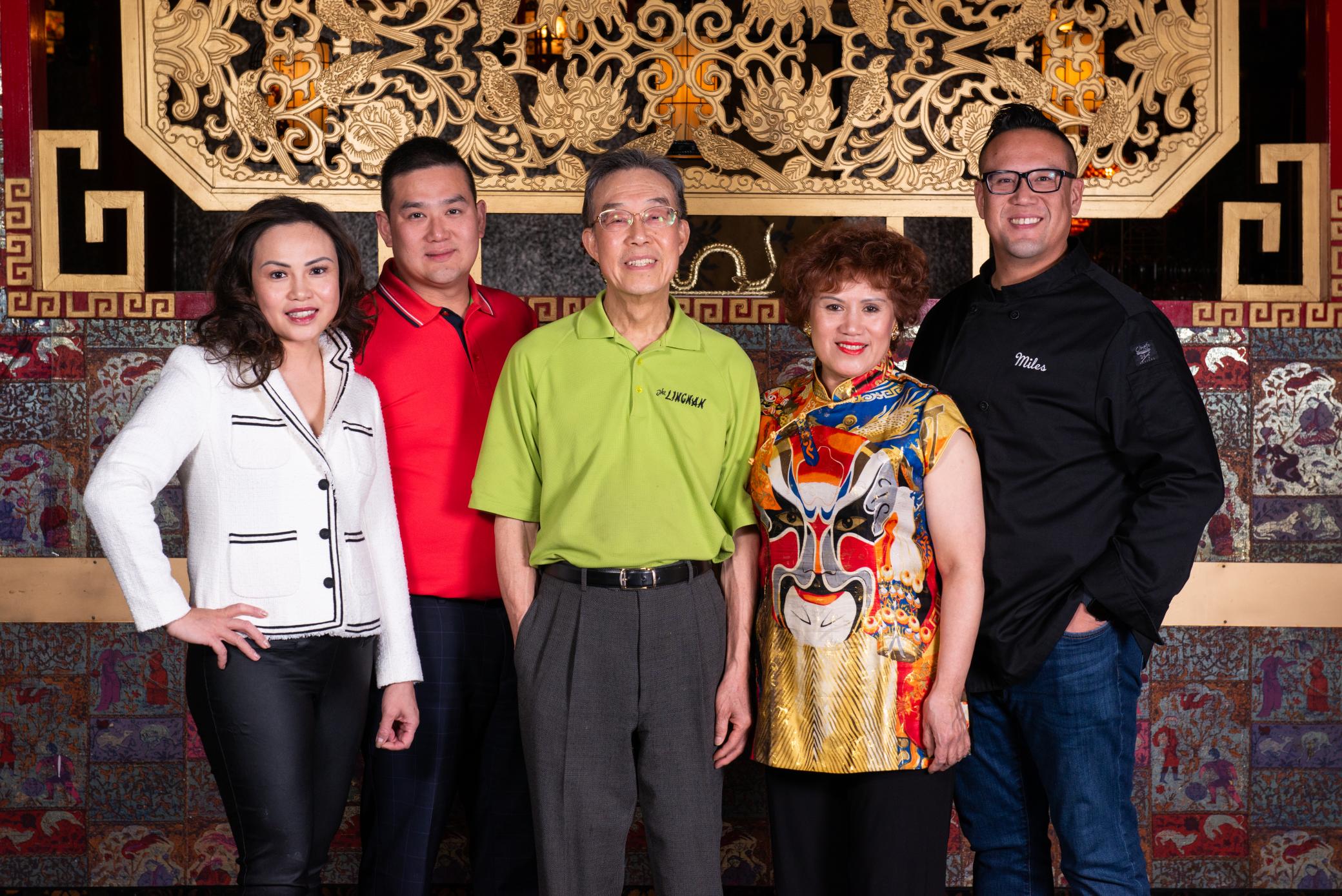 The Quon family posing for a photo inside of their restaurant, The Lingnan.