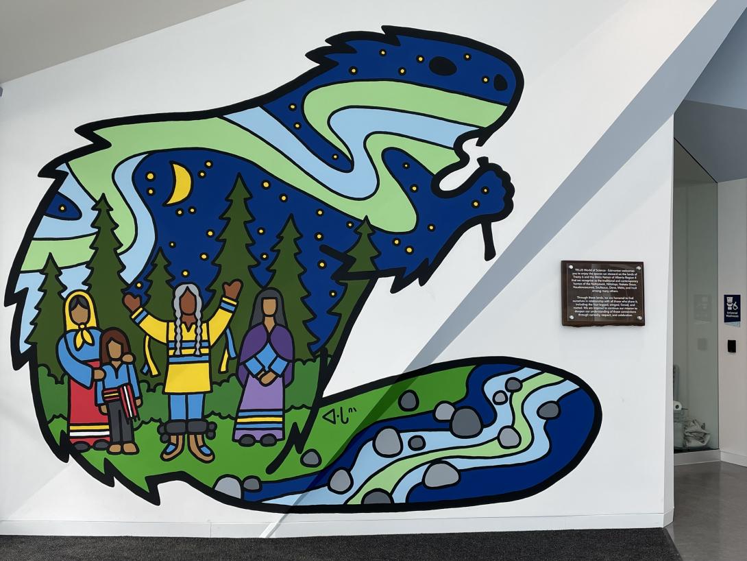  Lance Cardinal’s mural features a beaver, four Indigenous people, the moon, stars, northern lights, trees, earth, and water.