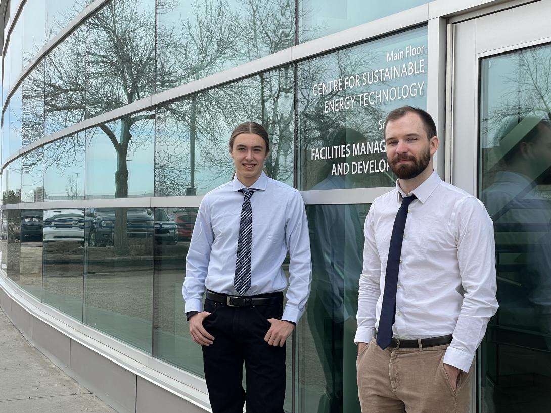 NAIT students Ethan Buchanan and Jack Harding standing outside the Centre For Sustainable Energy Technology.