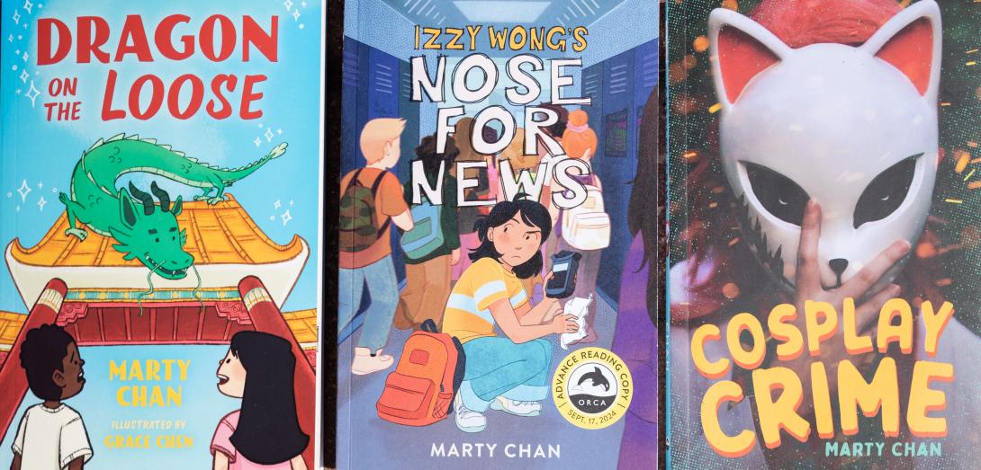 The covers of three books, featuring a dragon sitting on a gate, a girl with a backpack crouching in a school hallway filled with students, and a person wearing a cat-like mask. 