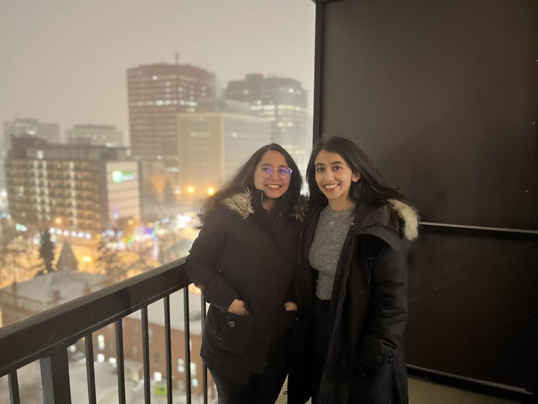 Charvi Dhamija, right, and her sister Vanika, on their apartment balcony in downtown Edmonton.
