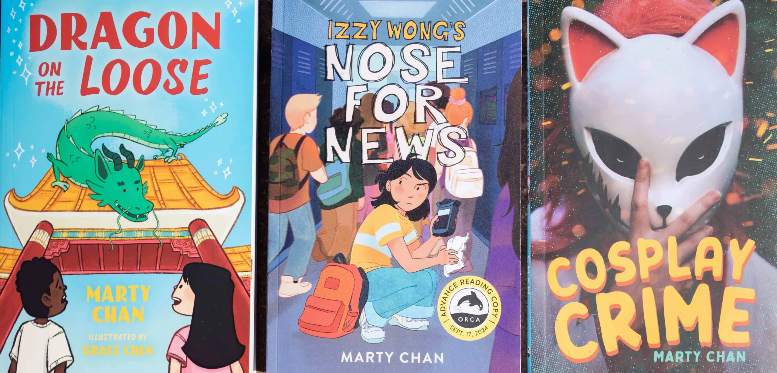 The covers of three books, featuring a dragon sitting on a gate, a girl with a backpack crouching in a school hallway filled with students, and a person wearing a cat-like mask.