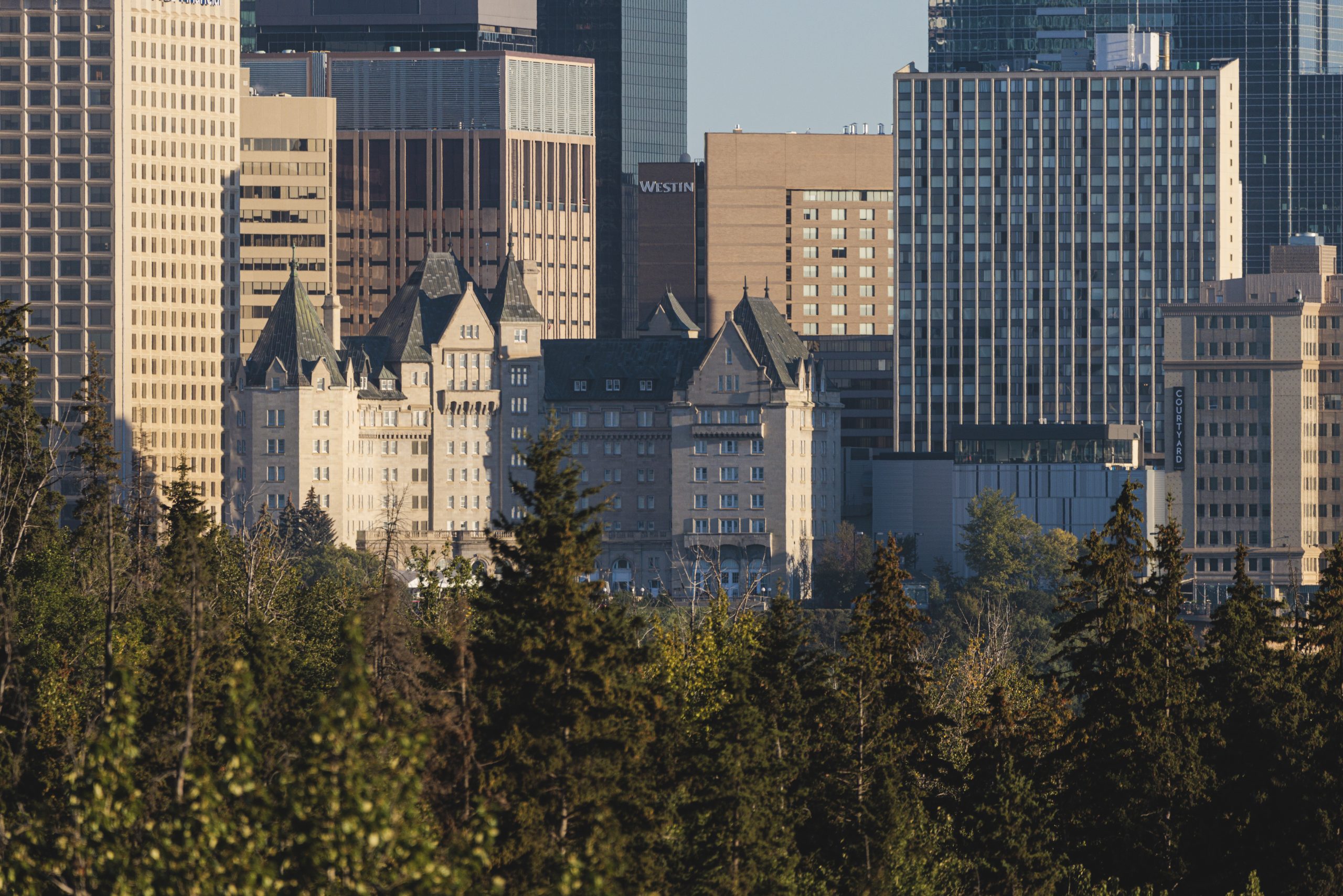 The historic hotel is part of the Edmonton's downtown skyline, overlooking the river valley