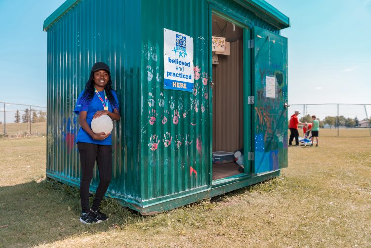 A Green Shack program coordinator next to her 'office' in the park
