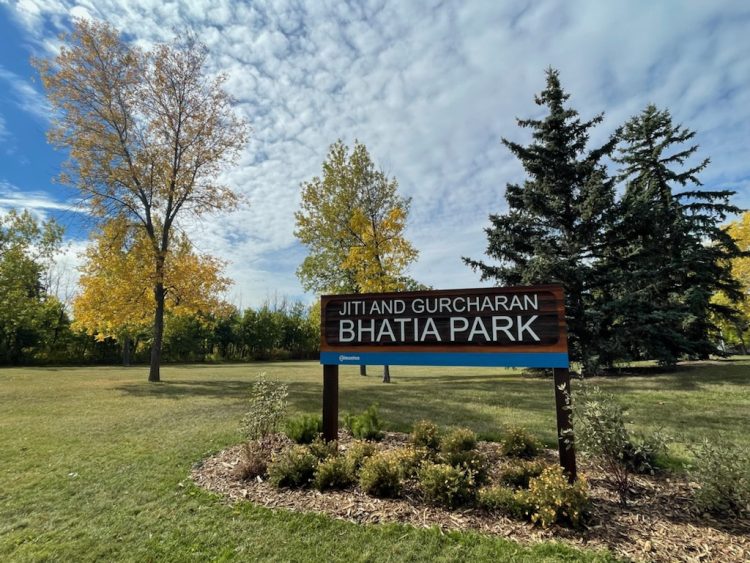 The City of Edmonton park sign 'Jiti and Gurcharan Bhatia Park' on a fall day