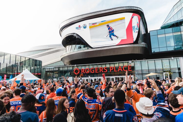 A massive crowd cheers watching the Oilers playoffs in Ice District