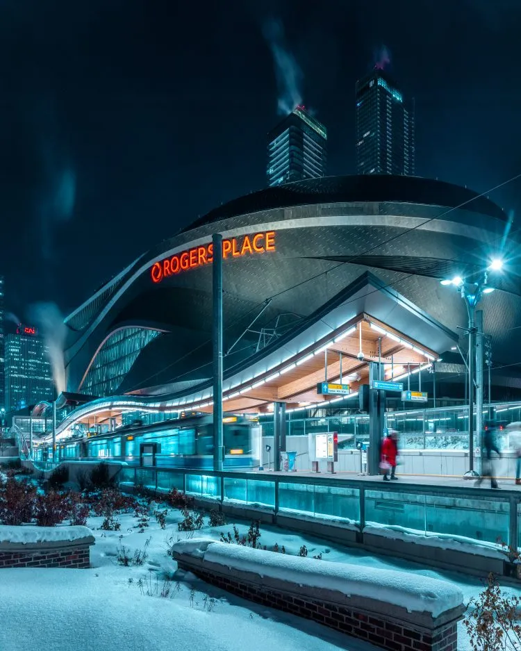 Rogers Place behind its transit station on a winter night