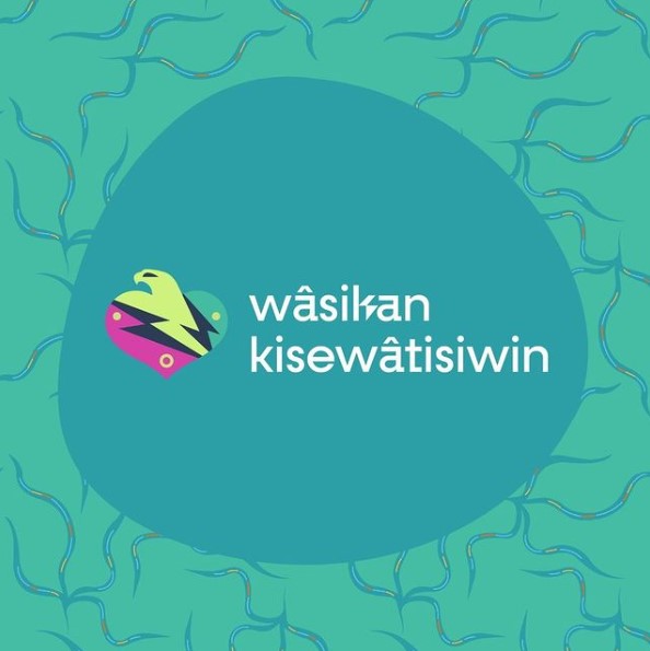 A teal graphic with a bird head coming out of a heard and words ‘wâsikan kisewâtisiwin’ written in a large circle in the middle.