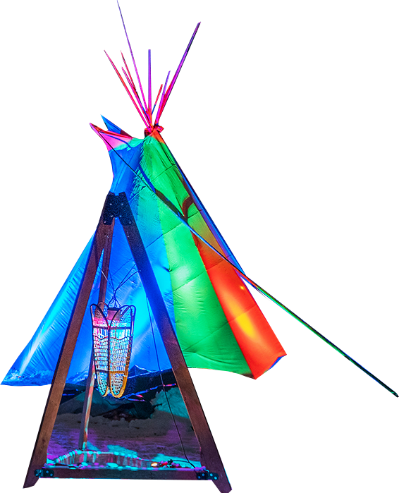 Cut out of a teepee and snow shoe holder in front. The teepee is lit up in colourful lights.