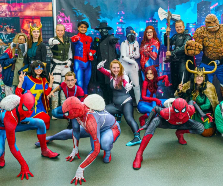 A large group of people dressed in comic inspired costumes, including Spiderman, The Flash and Thing. CR: Edmonton EXPO