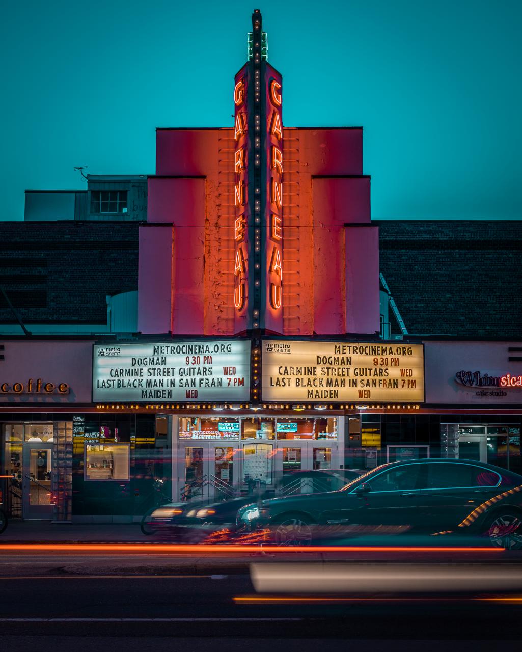 The marquee of the Garneau movie theatre is lit up at dusk. 