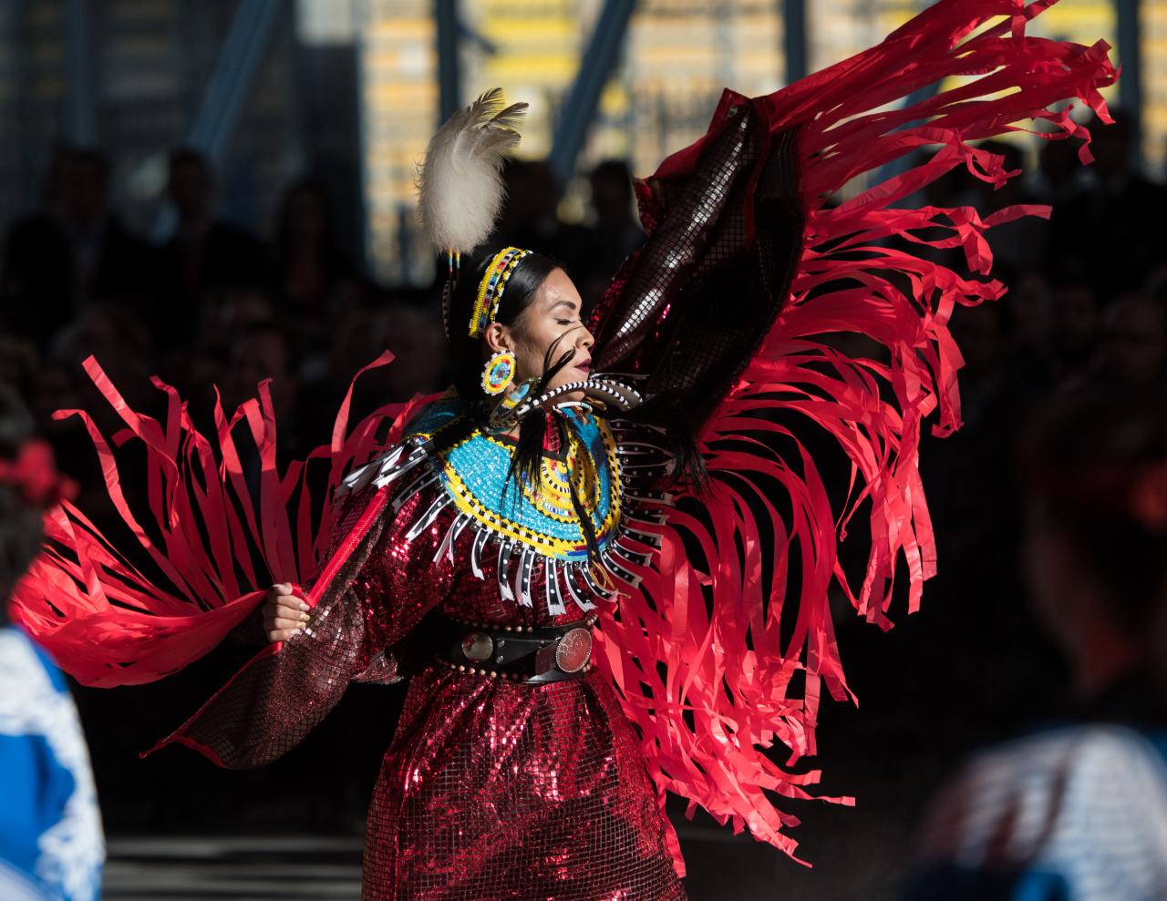 Indigenous dancer with red dress 