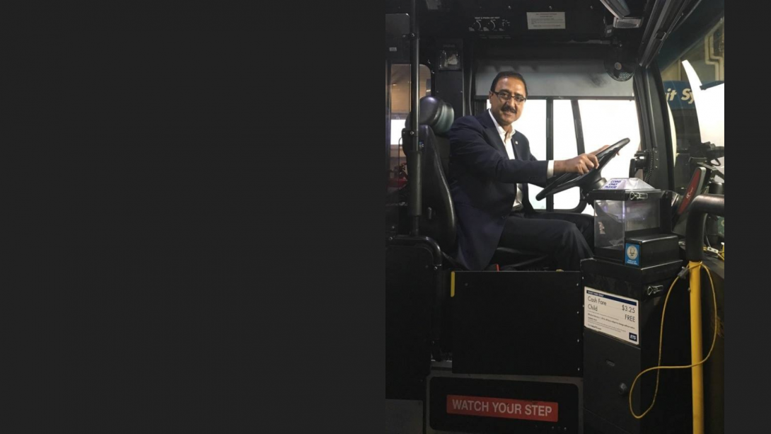 Mayor Amarjeet Sohi sits in the drivers seat of an Edmonton Transit Service bus.